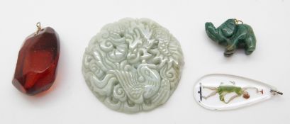 A collection of pendants including carved jadeite / hardstone depicting dragons, malachite elephant,