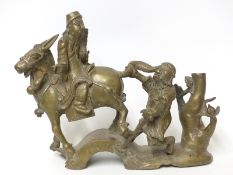 Chinese bronze of Confucius sat on a donkey with another man holding its tail,