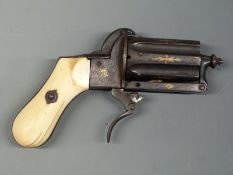 Unnamed 7mm six-shot pinfire hammer action pepperbox revolver with shaped ivory grips,