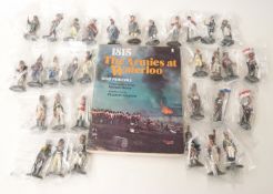 Thirty-two Del Prado Napoleon At War model soldiers and a book 'The Armies at Waterloo'