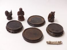 Two Japanese wooden netsukes with signatures to the base,