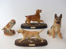 Four Royal Doulton figures including The Labrador, The Retriever,