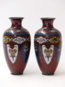 A pair of Japanese cloisonné vases, with red ground and floral decoration, 18.