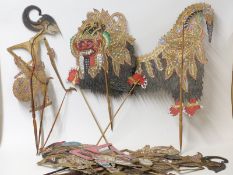 Six Oriental Wayong shadow puppets painted with gilt and pierced decoration