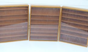 Three glazed toy/ model display cabinets each 62x48x9cm.