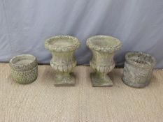 A pair of garden urns and two further pots