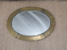 Oval bevelled edge mirror with brass frame,