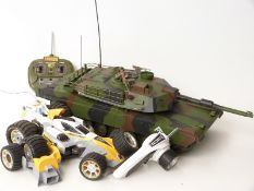 Remote control 1:16 scale model Abrams tank together with a remote control racing car with