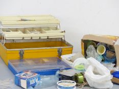 One tackle box and another box containing fishing accessories including lures,