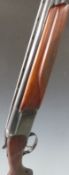 Baikal 12 bore over and under ejector shotgun with engraved locks,