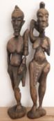 A pair of carved African figures of Adam and Eve,