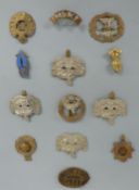 A collection of military badges to include Gloucestershire Regiment, Royal Engineers,