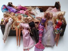 Approximately thirty Barbie dolls of differing ages