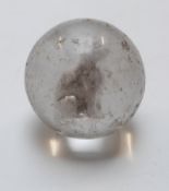 A glass marble with a sulphide cameo of a cat, 32.