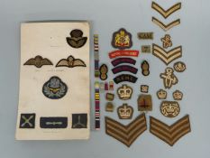 A quantity of fabric military badges,