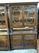 A glazed mahogany bookcase with two door cabinet under,
