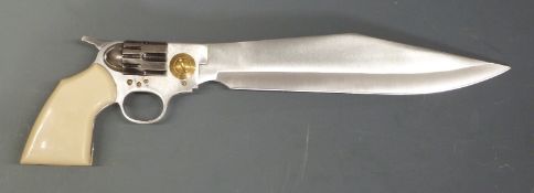 A novelty stainless steel knife in the form of a revolver with faux ivory handle,