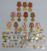 A collection of Soviet Union / Russian medal and badges,