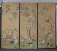 Three large prints/ panels decorated with exotic birds amongst prunus foliage laid on wooden panels