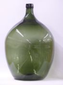 A large green glass carboy,