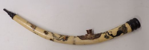 Chinese bone opium pipe with carved figural decoration,