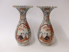 A pair of Japanese vases with flared rim and court scene decoration,
