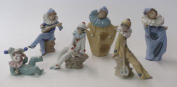 Six Nao figures of children dressed as clowns
