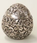 Indian Kutch or similar white metal pepper with embossed decoration, height 4.