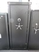 A 24 gun safe / cabinet with a rotated combination code lock,