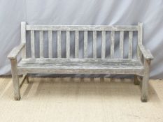 A teak garden bench by Lister,