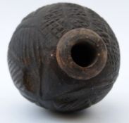 A 19thC carved and hollowed wooden vessel / carved nut with geometric design, 13 x 8.