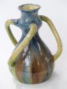 An 18th/19thC creamware 'Squire Toby' jug with foaming quart and shaped base,