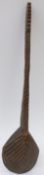 A 19th / 20thC carved African spoon / scoop with geometric decoration and ridged handle,