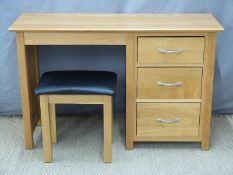 A modern light oak dressing table and stool,