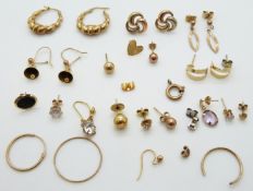 A collection of 9ct gold/ yellow metal earrings including a pair of 9ct gold hoops,
