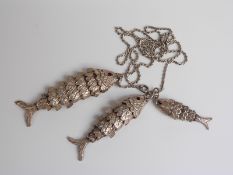 Graduated set of three hallmarked silver articulated fish, marks indistinct but likely London 1977,