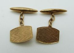 A pair of 9ct gold cufflinks with engine turned decoration, 3.