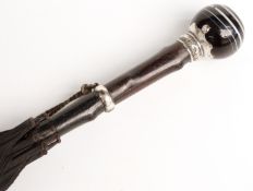 A 19thC parasol with spherical banded agate handle on white metal mount and suspension collar in