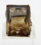 A 9ct gold ring set with a large smoky quartz,