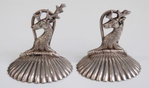A pair of Victorian Walker & Hall hallmarked silver novelty menu holders formed as stags on a shell
