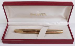 Sheaffer 797 fountain pen with gold plated barrel, cap and clip and 14ct gold medium nib,