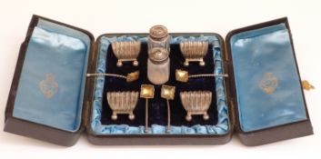 A cased set of four Victorian hallmarked silver salts and spoons,