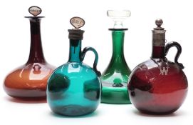 Two mallet-shaped glass decanters, one with silver plated mounts and whisky label,