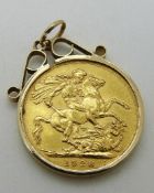 A 1928 gold full sovereign in a 9ct gold clip mount,