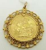 A 1967 gold full sovereign in yellow metal clip mount, 14.