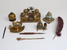 A collection of inkwells including novelty globe impressed Baxter,16 Cockspur St, brass standish,