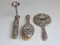 Hallmarked silver three piece dressing table set and a hallmarked silver trumpet vase