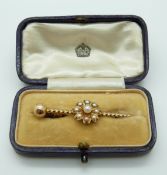 Edwardian brooch set with seed pearls in a flower setting, in original box, 3.36g, 4.3 x 1.