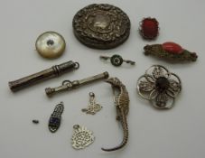 A group of brooches to include Scottish silver thistle set with quartz, white metal and coral,