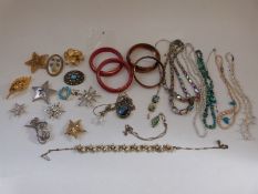 A collection of jewellery to include pearl necklace, turquoise necklace, Grosse brooch,